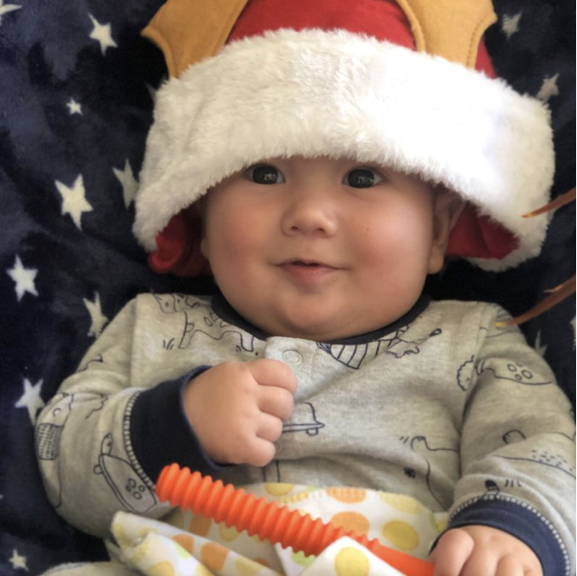 Happy baby using a teething tube